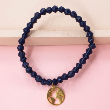 Ethically made fair trade bracelet with handmade paper beads and gold plated world charm.