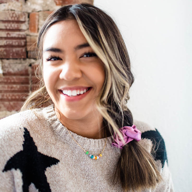 The Petite Rainbow Necklace is made with tiny rainbow beads and 14k gold filled chain by artisans in the Horn of Africa. Sustainable, Artisan-Made And Ethically Sourced. Sustainable, Artisan-Made And Ethically Sourced