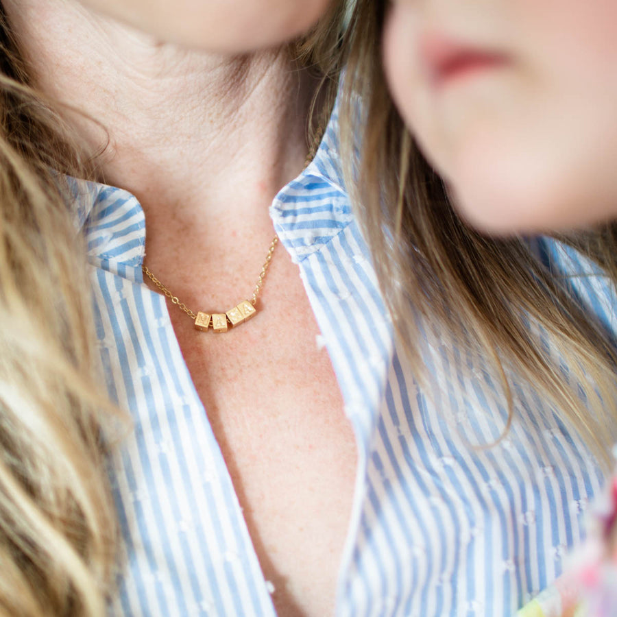 Ethical made 14k gold plated chain necklace with MAMA block letters.
