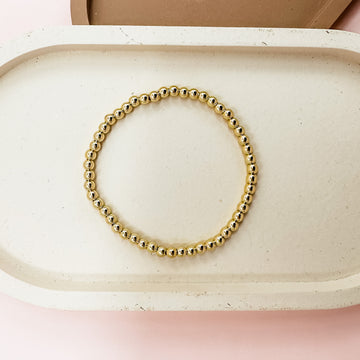 ethically made 18k gold plated brass beads on stretch wire