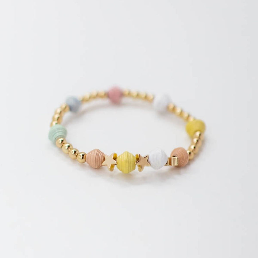 kid stretch bracelet ethically made with handmade paper beads, gold star beads and gold beads.