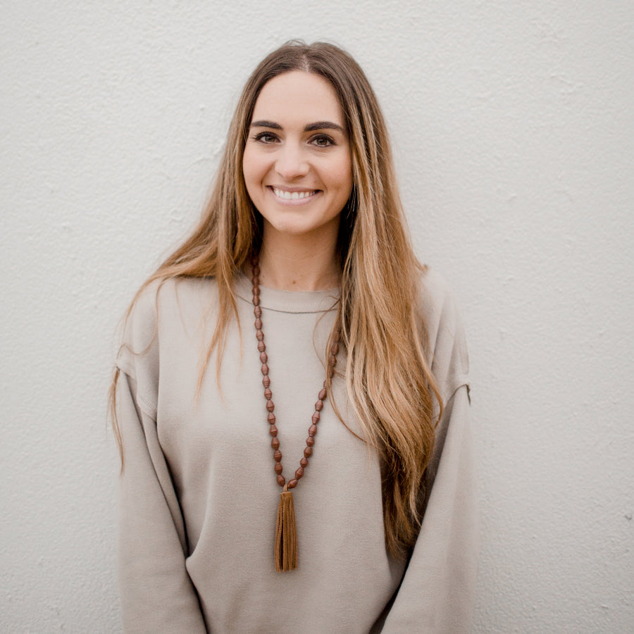 The Chai Necklace: brown handmade paper beads with fair trade certified leather tassel necklace by artisans in the Horn of Africa