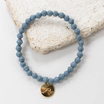 beaded bracelet with wave pendant and charm