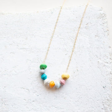 The Petite Rainbow Necklace is made with tiny rainbow beads and 14k gold filled chain by artisans in the Horn of Africa. Sustainable, Artisan-Made And Ethically Sourced. Sustainable, Artisan-Made And Ethically Sourced
