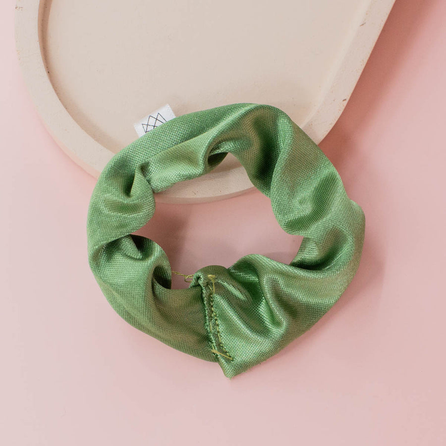 ethically made green silky scrunchie for baby