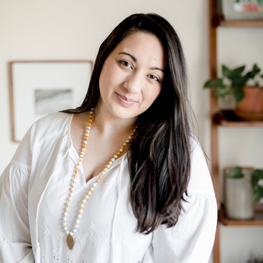 The Leaf Pendant necklace is made with handmade paper beads with brass charm from Ethiopia by artisans in the Horn of Africa. Sustainable, Artisan-Made And Ethically Sourced